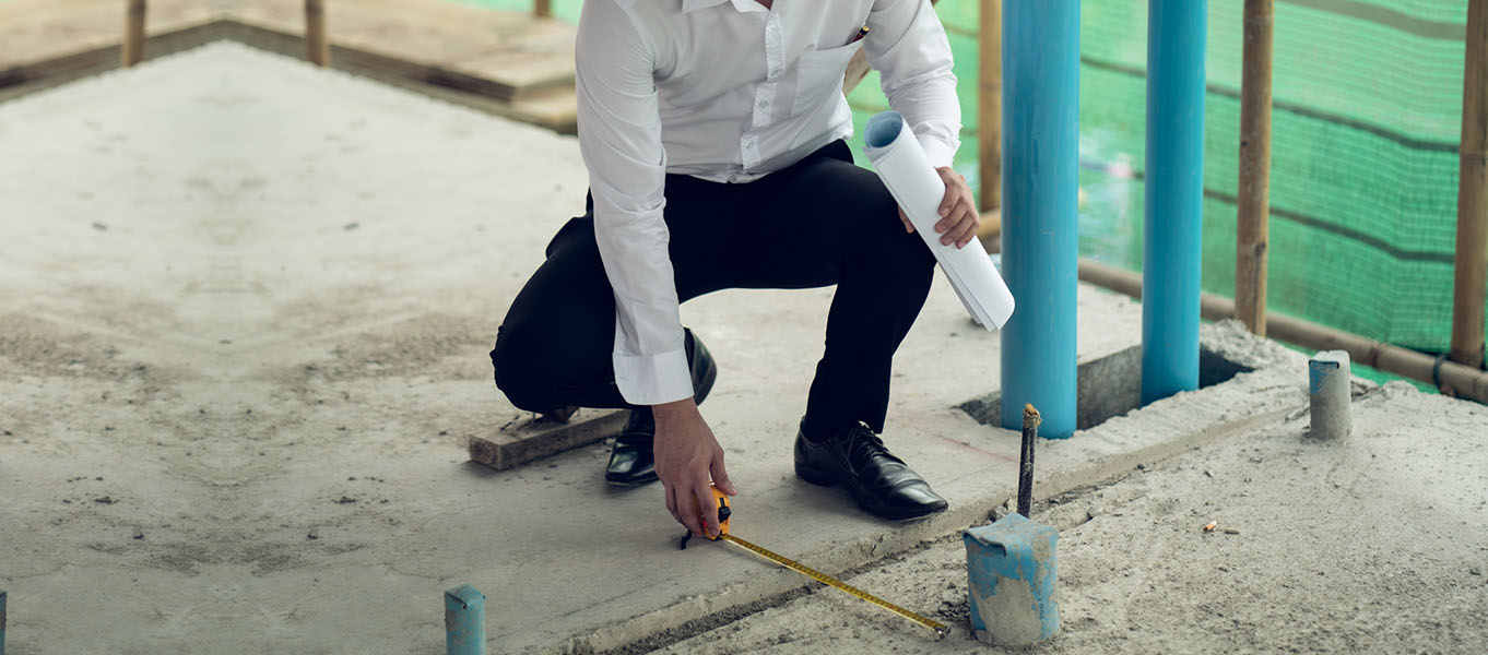 Livic engineer marking building footings at construction site